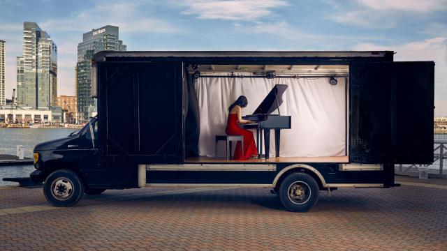 Susan Zhang playing the piano inside the Concert Truck