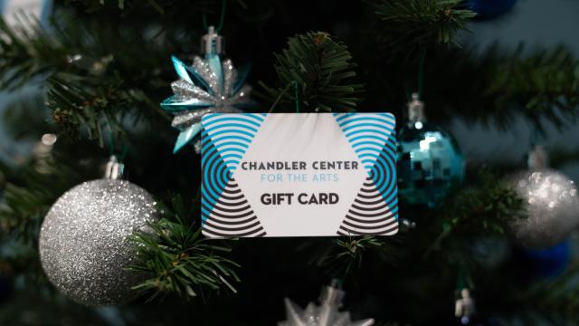 CCA gift card in tree with blue and silver ornaments