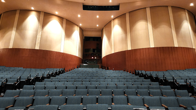 Renovated full theatre rendering with blue seats