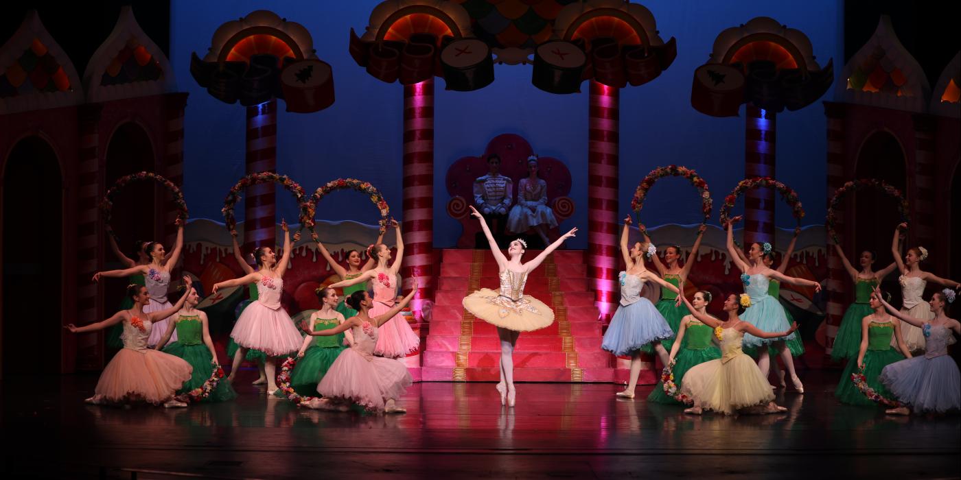 ballerinas dance in various colored tutus