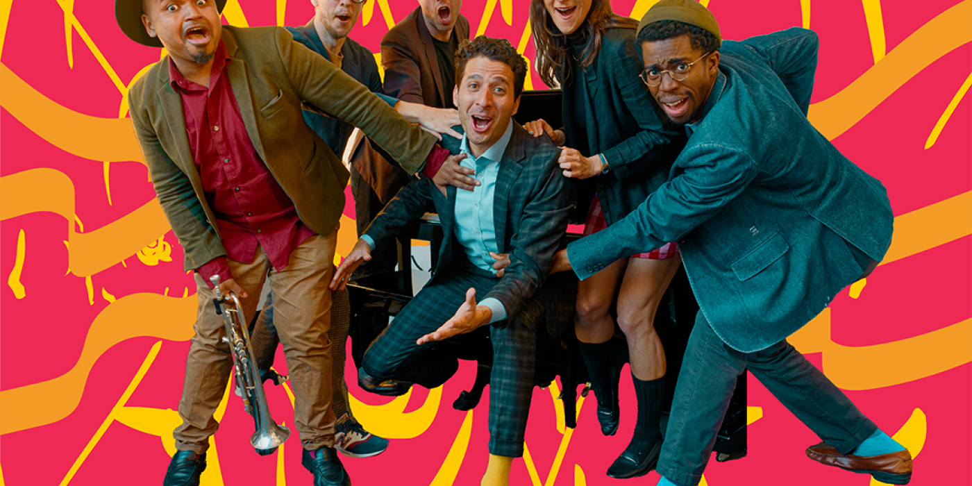 A group of six people are gathered together, looking at the camera with a red and yellow background