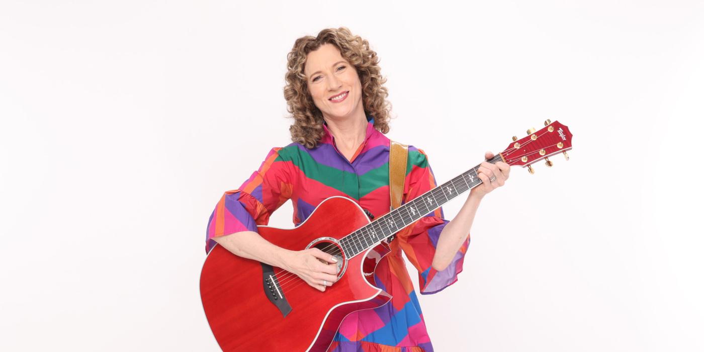 Laurie Berkner with guitar