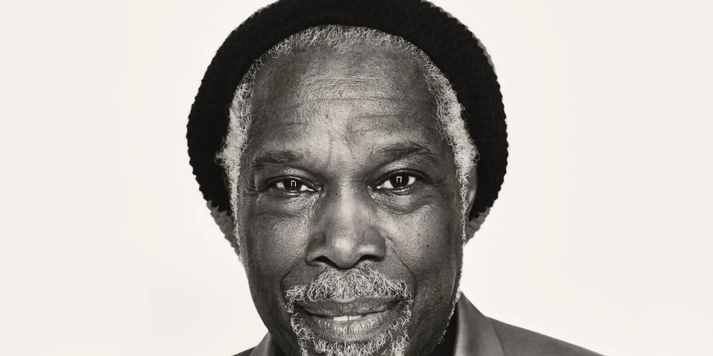 Black and white photo of Billy Ocean wearing a hat
