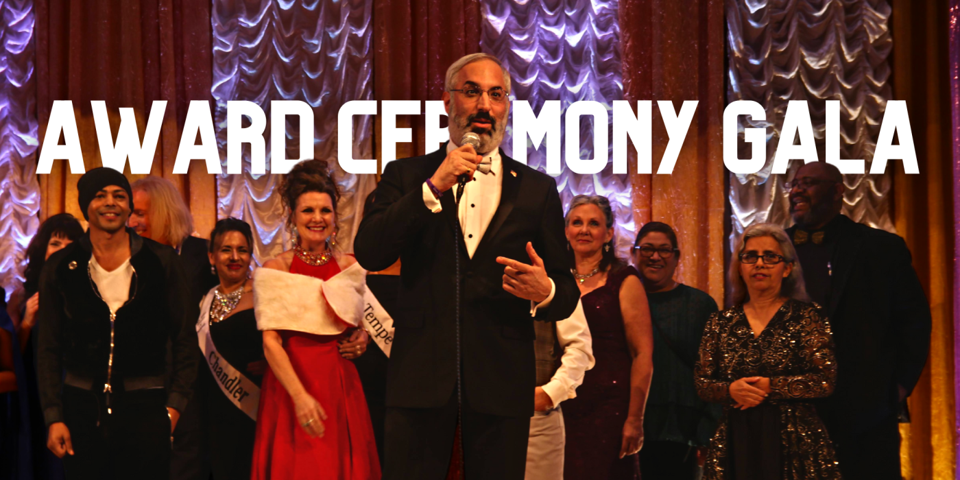 people on stage with person talking into a microphone