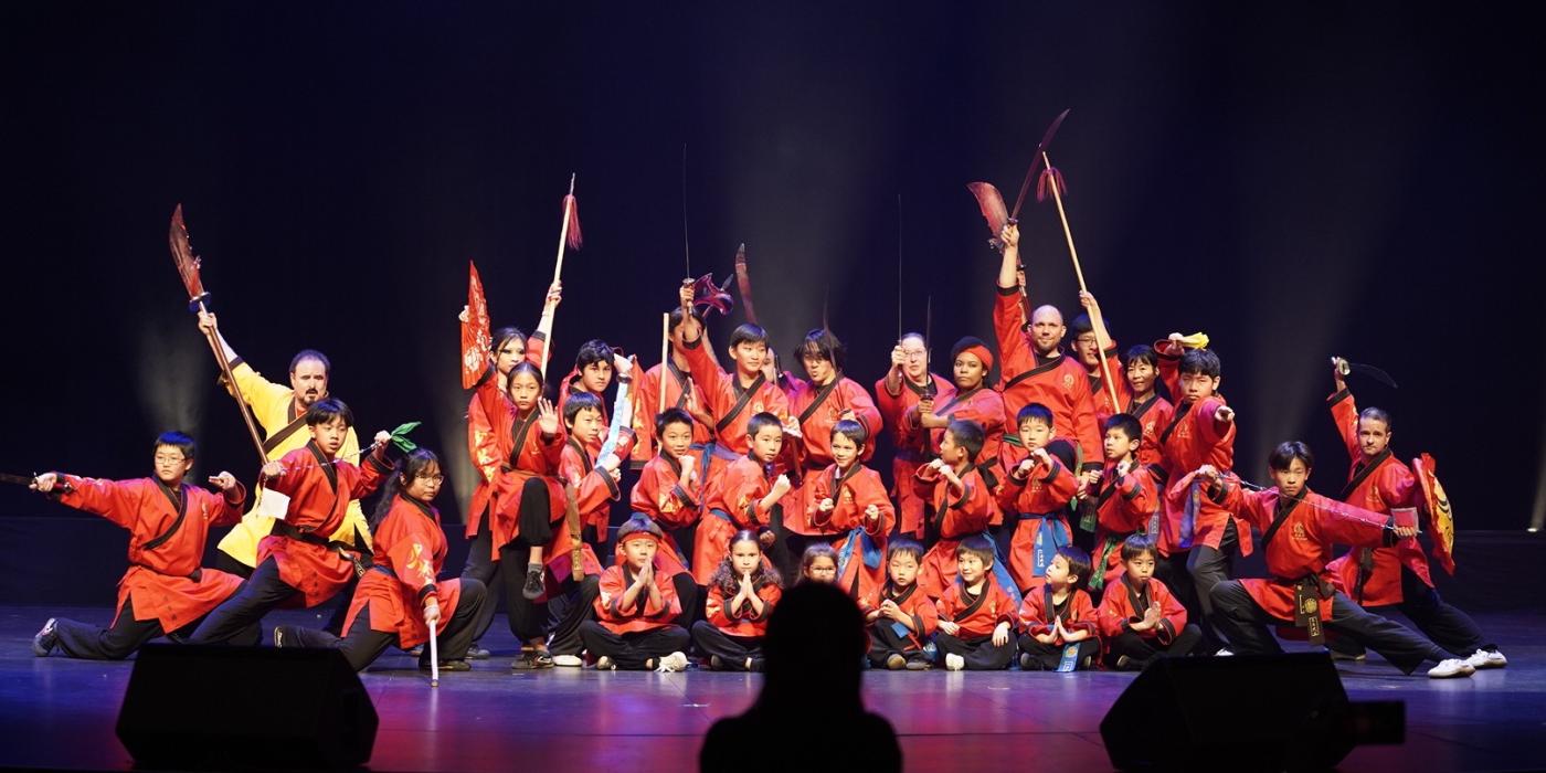 Spriing Festival Gala Asian Dancers in a group dressed in red costumes