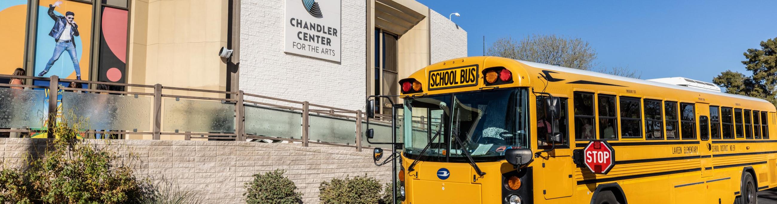 School bus parked outside of CCA box office