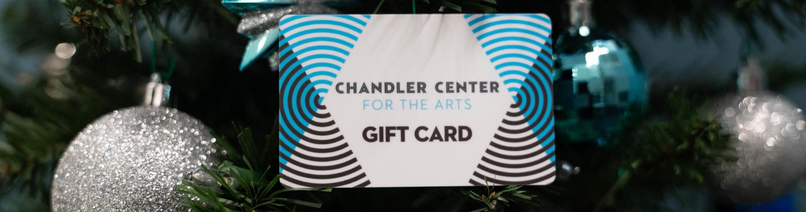CCA gift card in tree with blue and silver ornaments