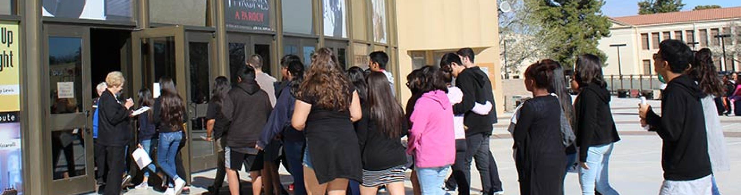 Students entering the CCA for a performance
