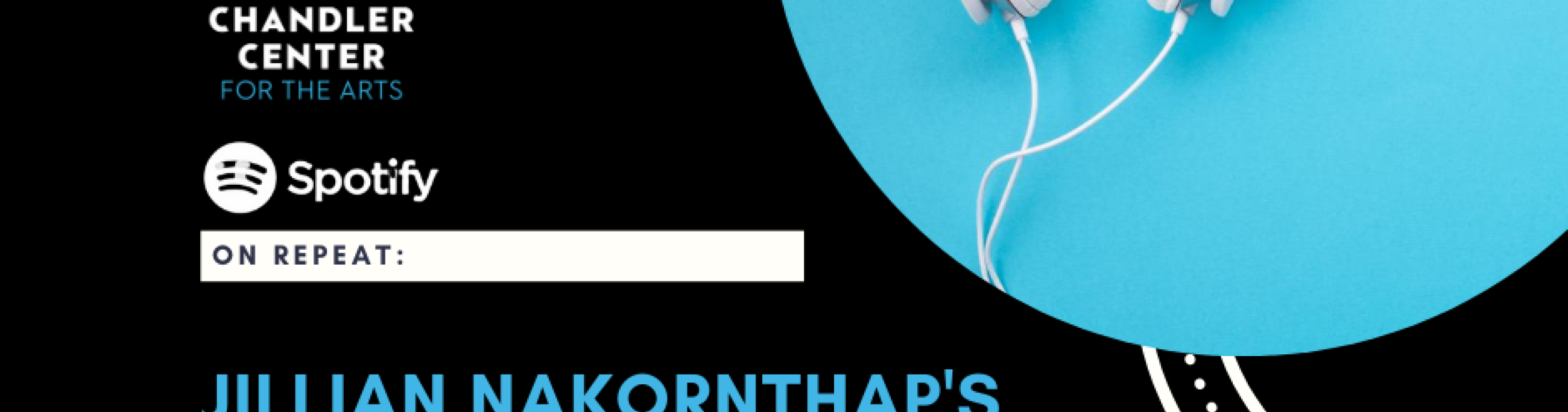 White headphones connected to a wire.