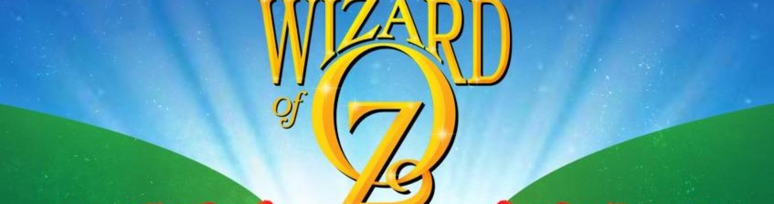 Gold letters proclaim Wizard of OZ with a yellow brick road below it