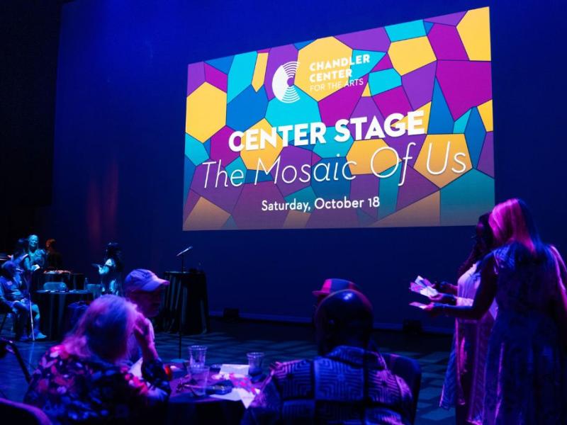 Center Stage Mosaic of Us Slide shown on stage