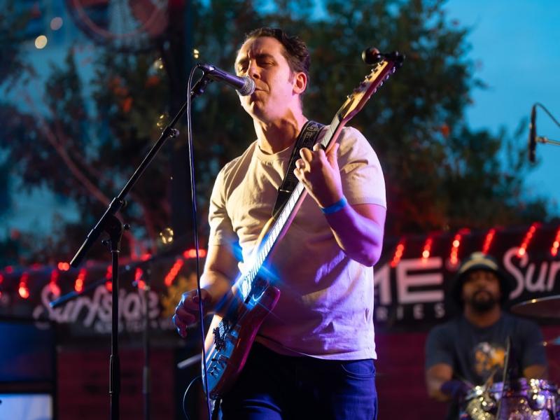 vocalist from The Conveyors performing on stage