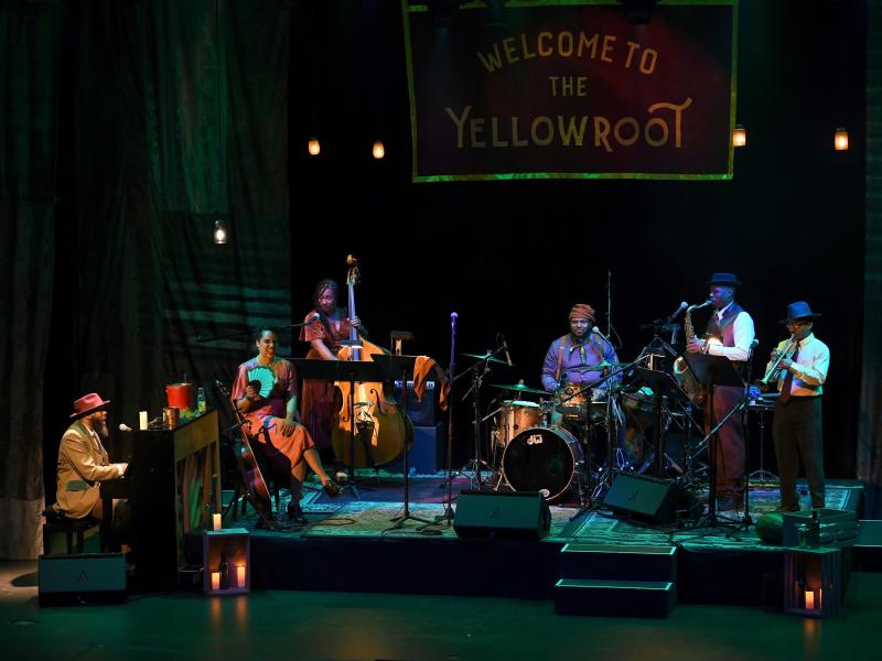the cast of The Yellowroot performing on stage