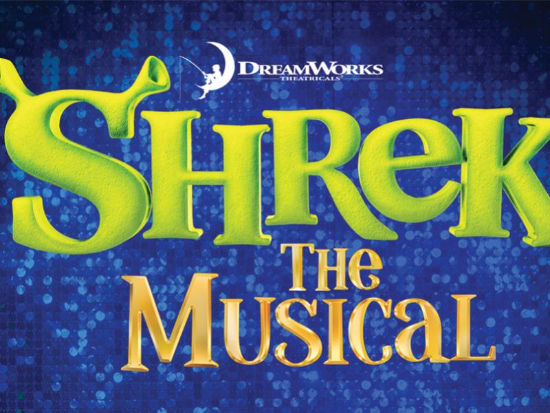 Shrek in green font in front of a sparkly blue textured background