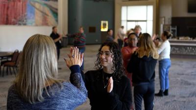 group of people clapping hands together
