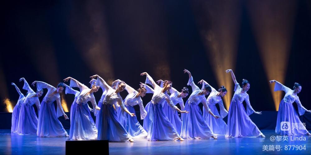 Spring Festival Gala group of female dancers on stage lit with blue light