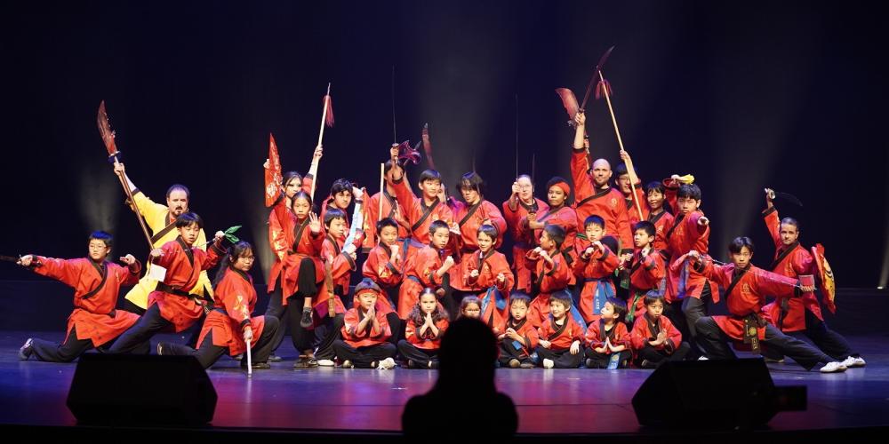 Spriing Festival Gala Asian Dancers in a group dressed in red costumes