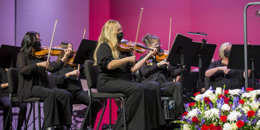 A zoom in on the all-female violin section of the symphony