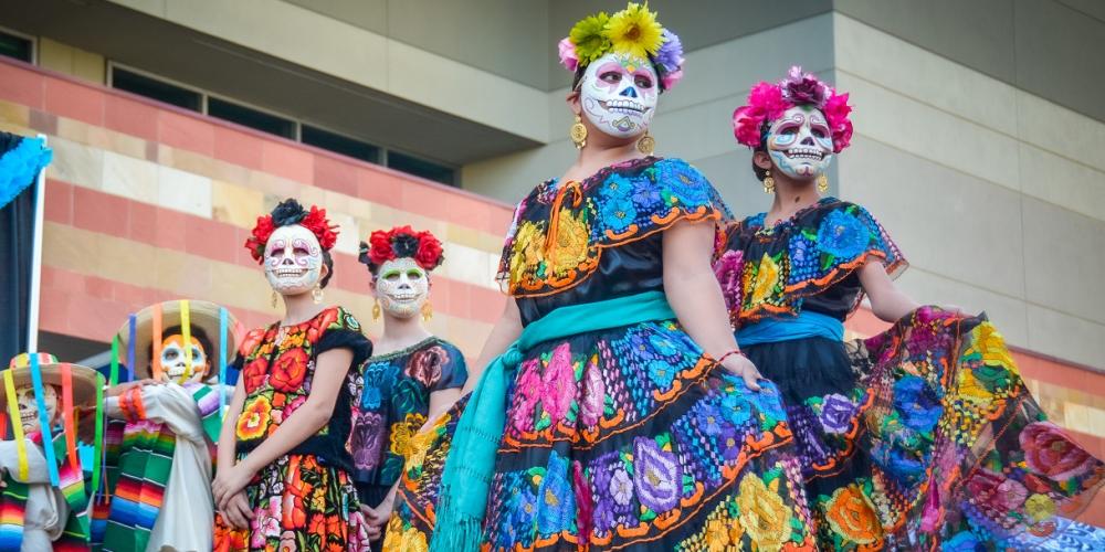 Young girls and boys dressed as day of the dead characters