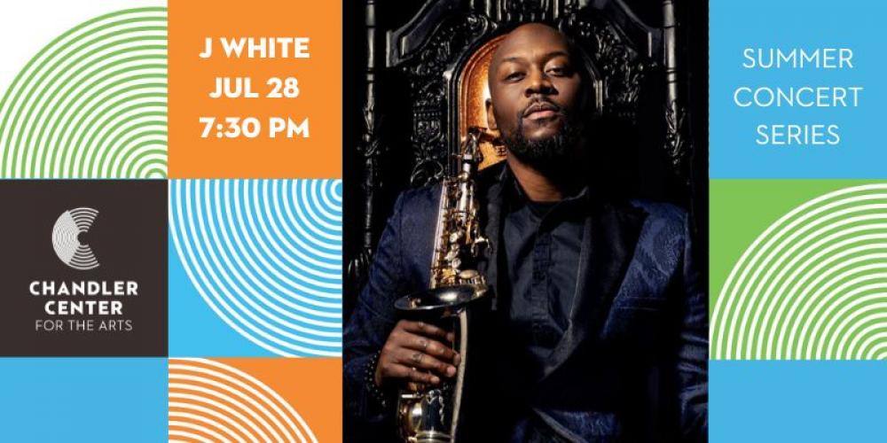 Dark skinned man standing in black clothing holding a saxophone