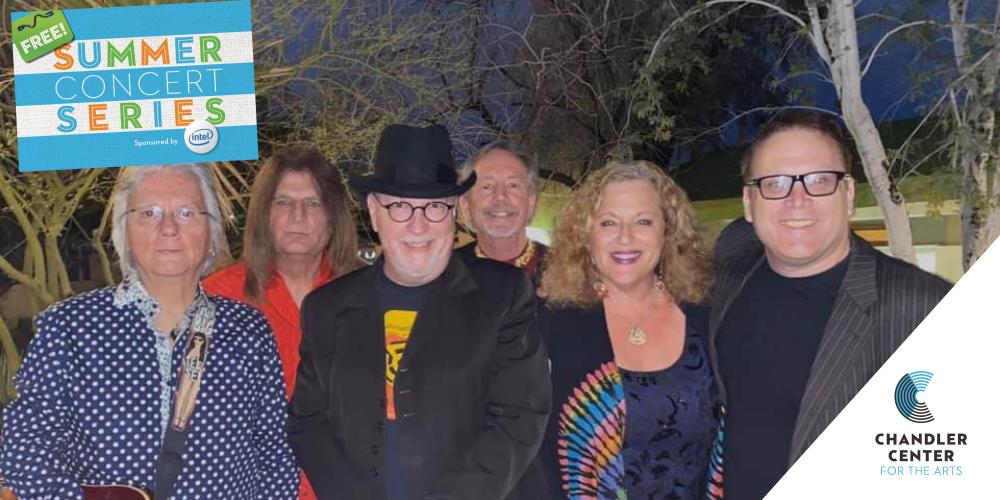 Six people smile at the camera, dressed colorfully.