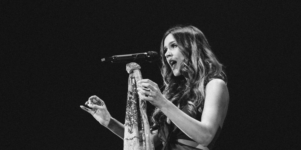 Joss Stone singing on stage black and white photo