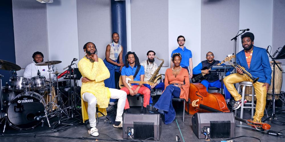 Mwenso & The Shakes wearing bright yellow, blue and orange colored clothing