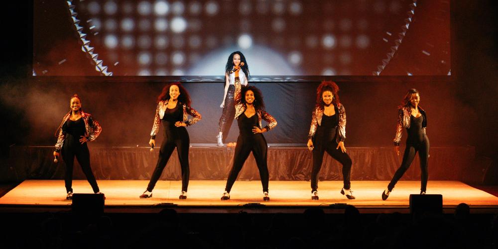 Syncopated Ladies posing on stage