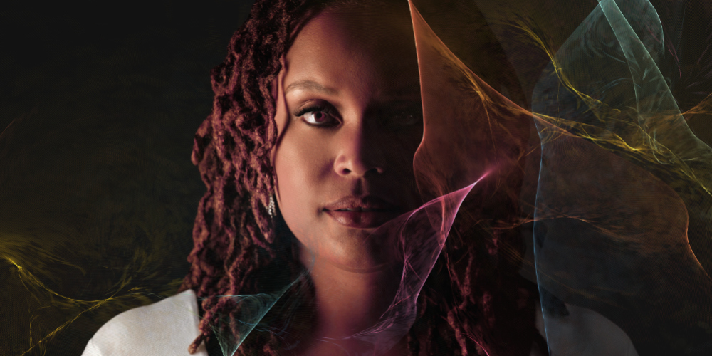 Woman with half her face in shadow and colorful smoke-like texture