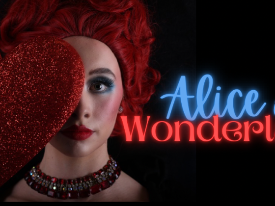 dancer with red hair covered partially with a large red heart
