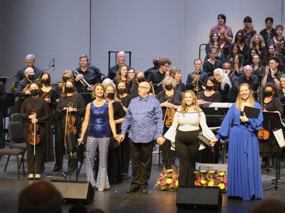 Chandler Symphony presents ...With Orchestra performers standing in front of orchestra