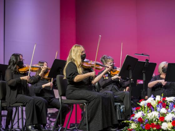 A zoom in on the all-female violin section of the symphony