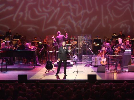 Jack Wright standing in front of orchestra