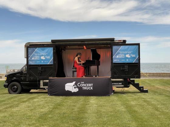 Susan Zhang plays the piano in the Concert Truck