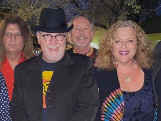 Chandler Center of the Arts Summer Concert Series sponsored by Intel presents Marmalade Skies Six people smile at the camera, dressed colorfully.