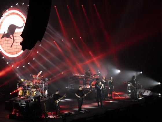 Chandler Center for the Arts presents The Australian Pink Floyd Show A band stands on a stage with red laser lights and an LED screen projecting a kangaroo