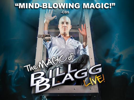 A bald man wears a button up shirt and slacks, sitting in a glass box. Text says "Mind-blowing magic!"
