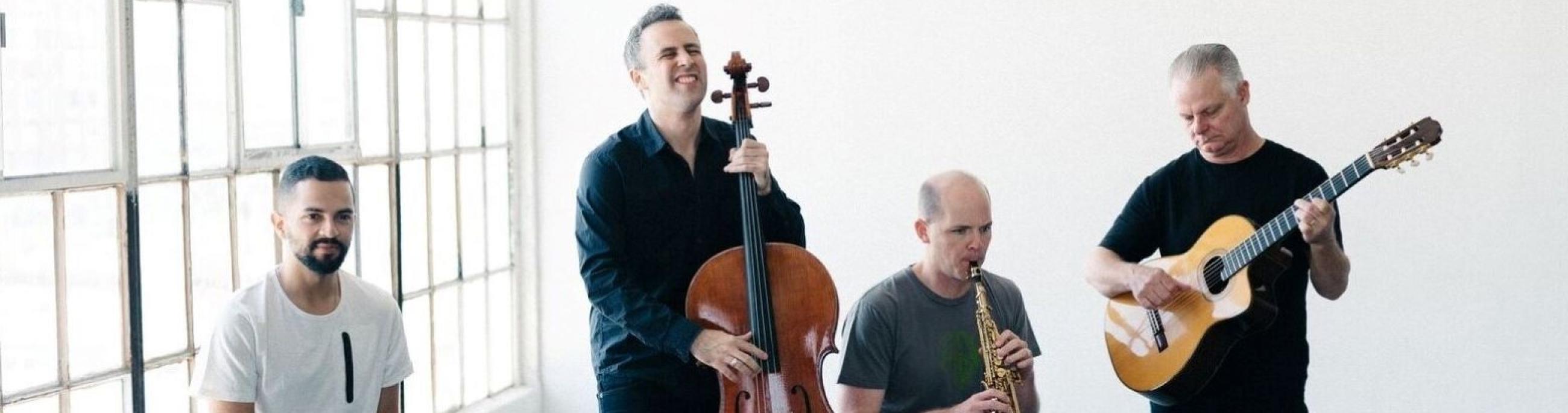 Four members of Quarteto Nuevo perform in a bright, airy industrial loft.