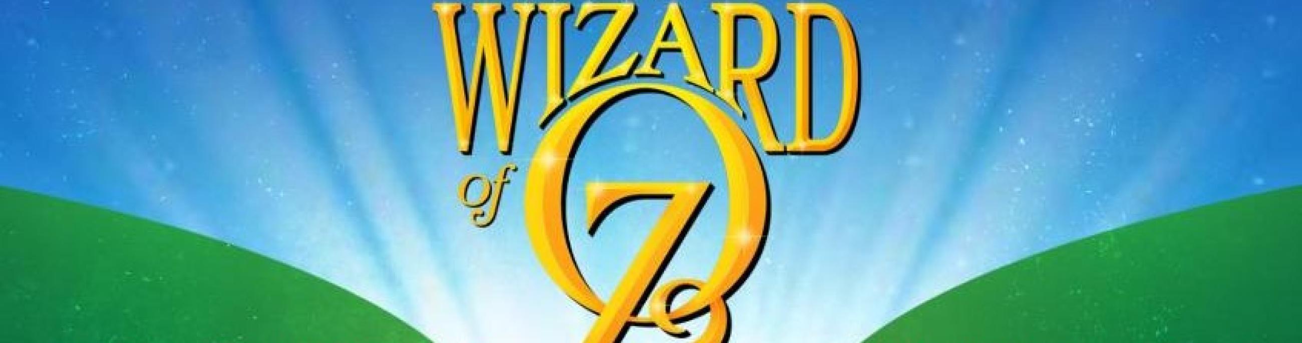 Gold letters proclaim Wizard of OZ with a yellow brick road below it