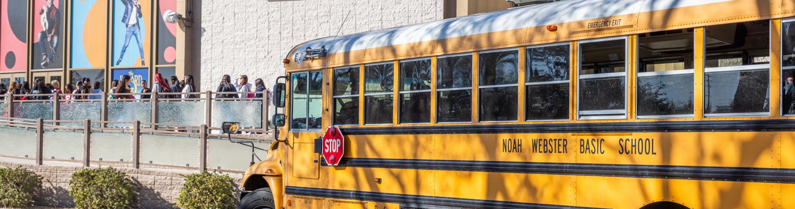 school bus parked outside of Chandler Center for the Arts and box office sign
