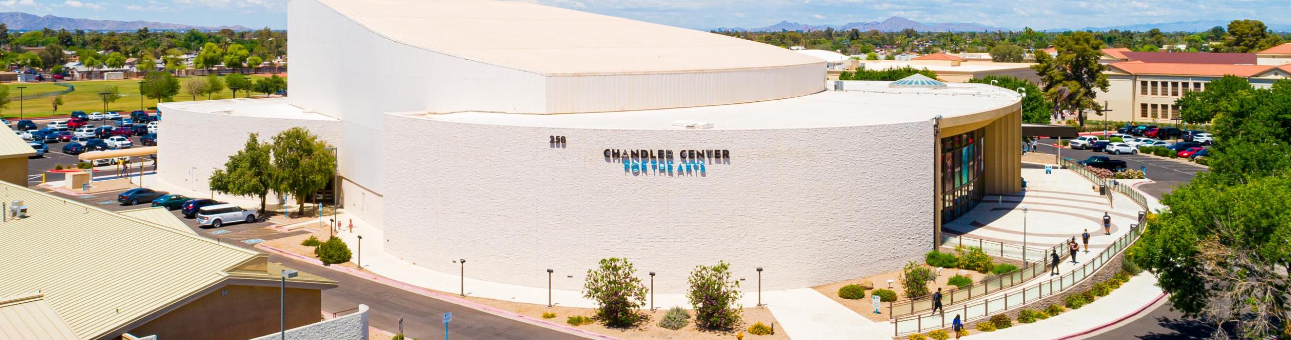 An aerial view of the performing arts center from the south with blue skies in the background