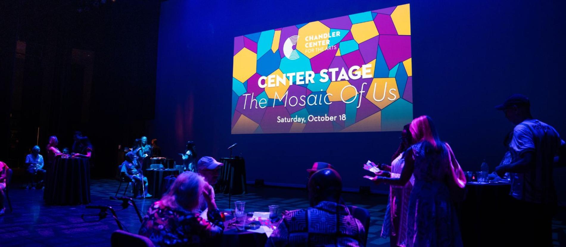 Center Stage Mosaic of Us Slide shown on stage
