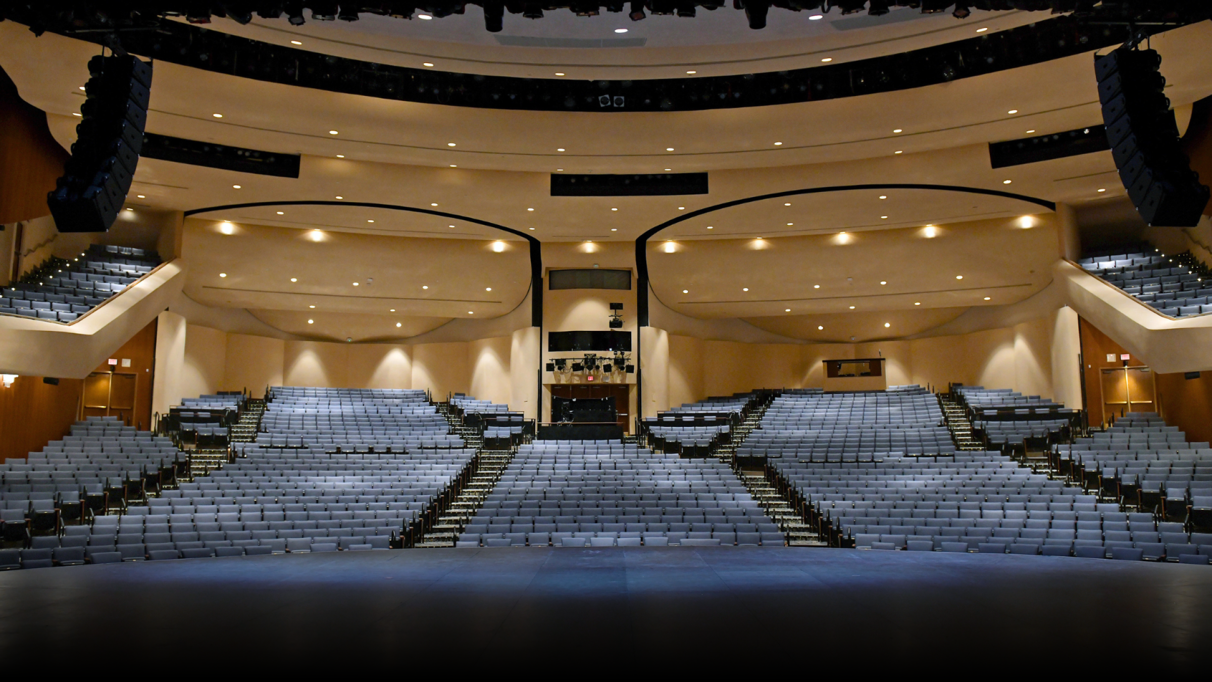 wide shot of the main stage with blue seats