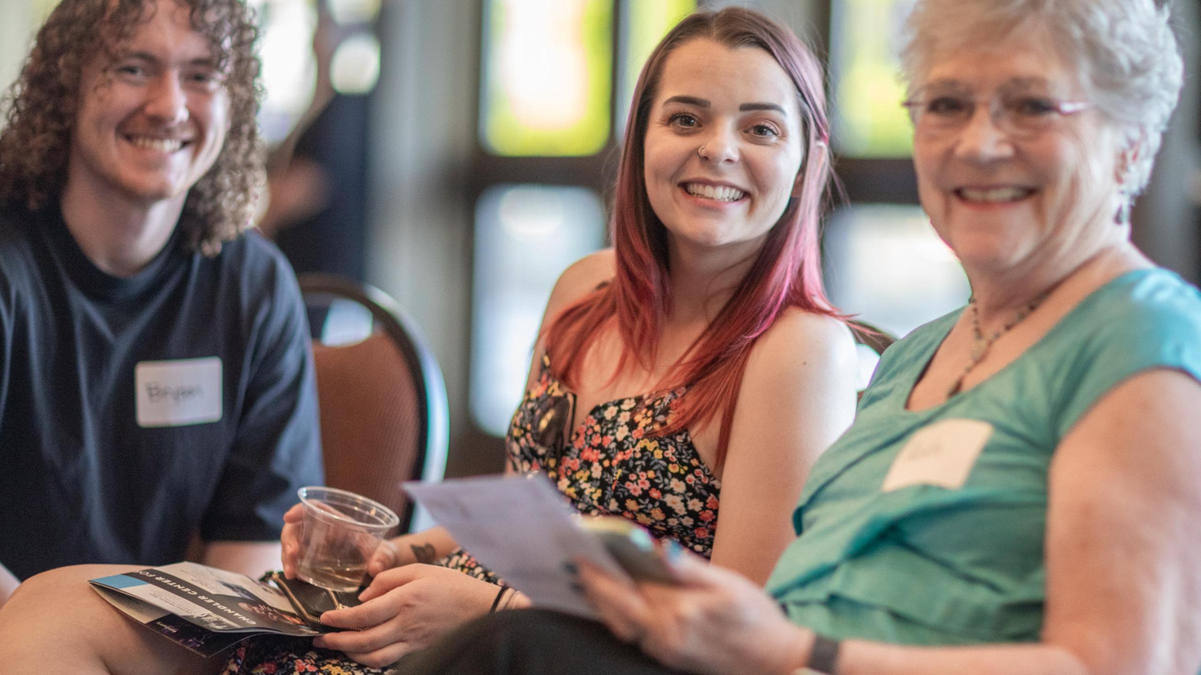 a group of 3 members reviewing the season line up