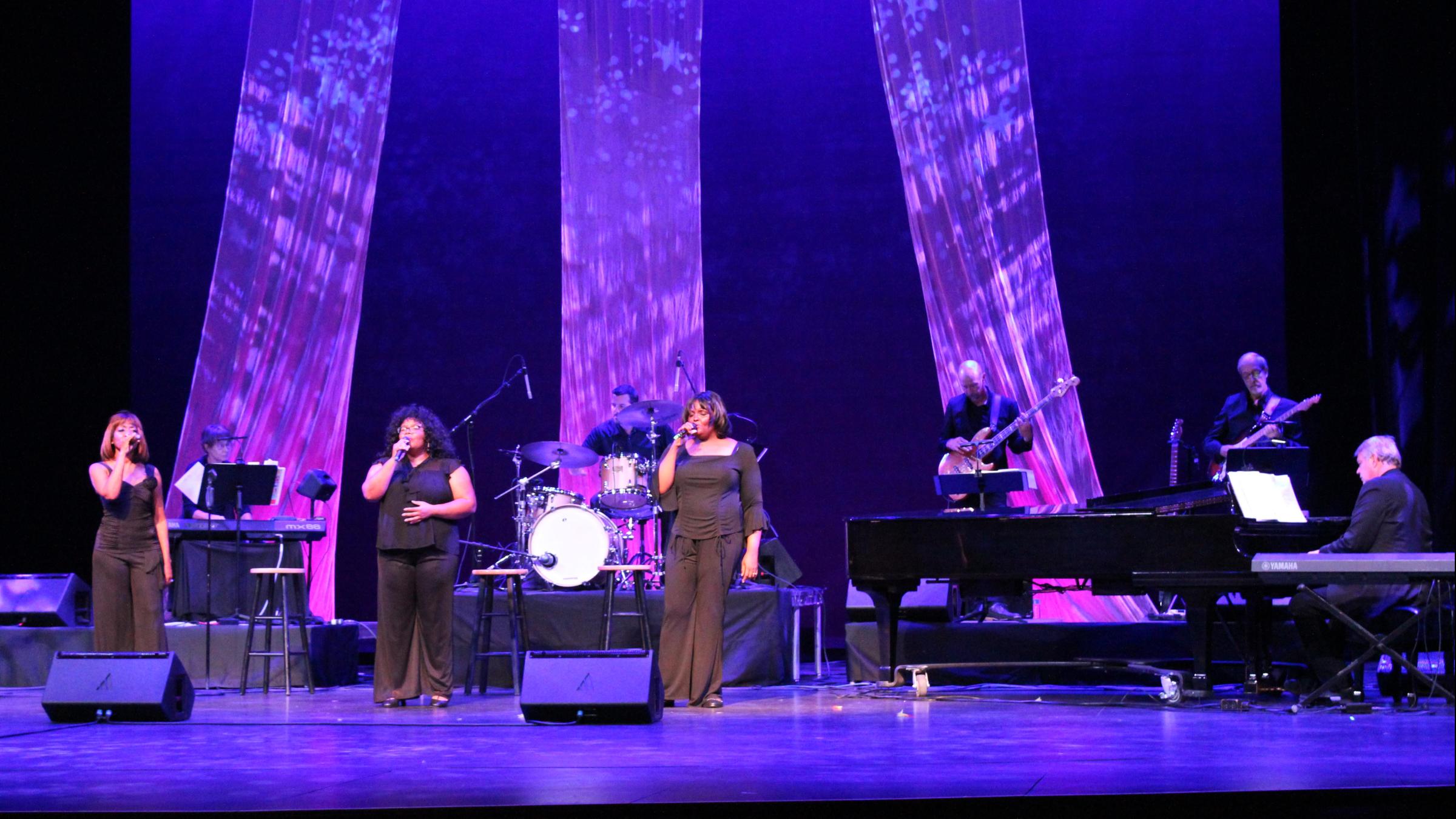 The Legendary Ladies of Soul trio sings on the CCA mainstage in front of the band in black gowns